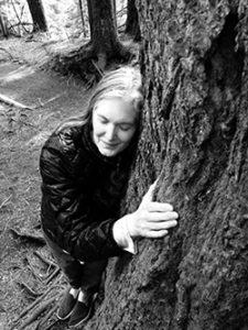 Michelle hugging a tree